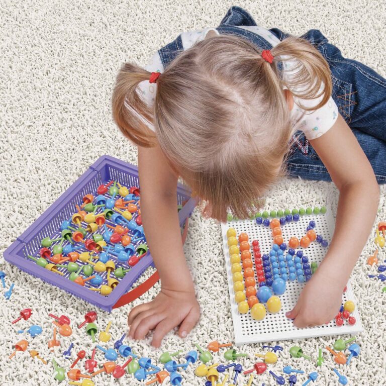 little girl playing with education mosaic pins toy